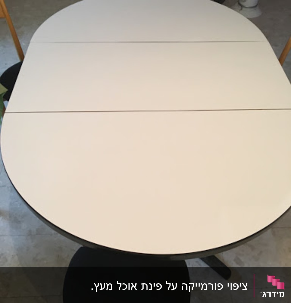 Oval table with wooden chairs around it